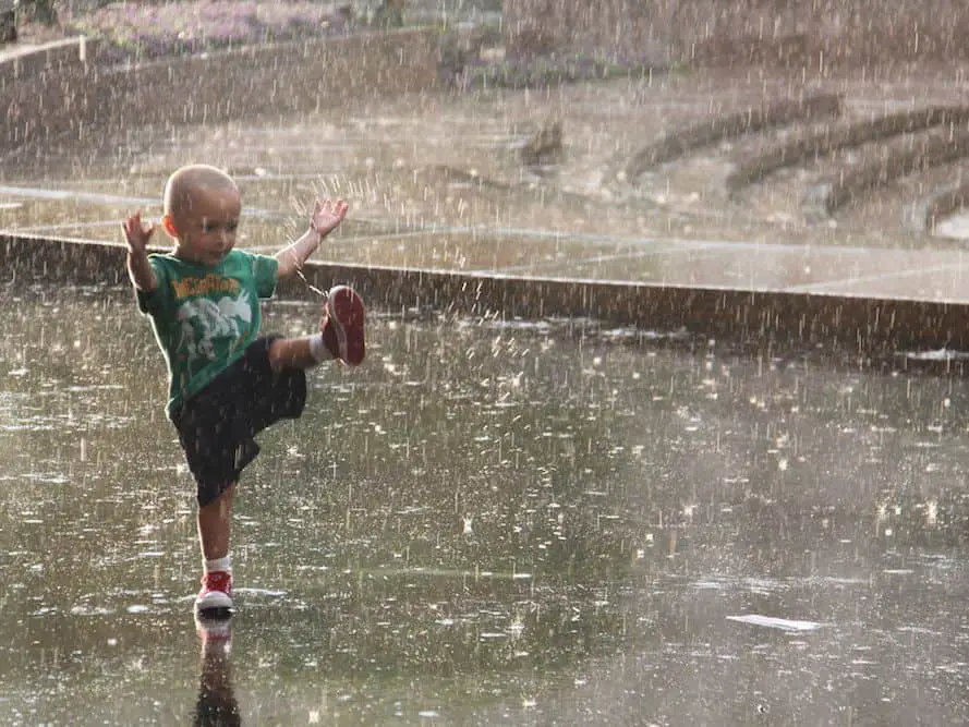 opt aboutcom coeus resources content migration treehugger images 2019 04 boy playing in the rain a11be252d850423494cc6460157bd0b6 17 Tips To Be More Present In The Moment