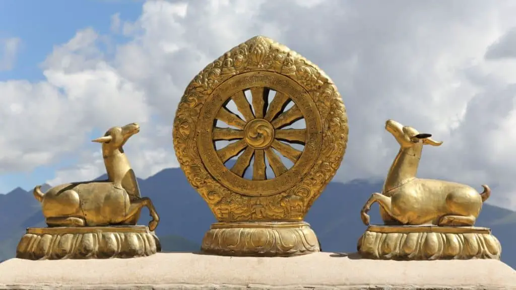 golden dharma wheel 153837012 a725e73142004472a3a4eeb973872646 Explaining The Dharma Wheel: Meaning & Origin
